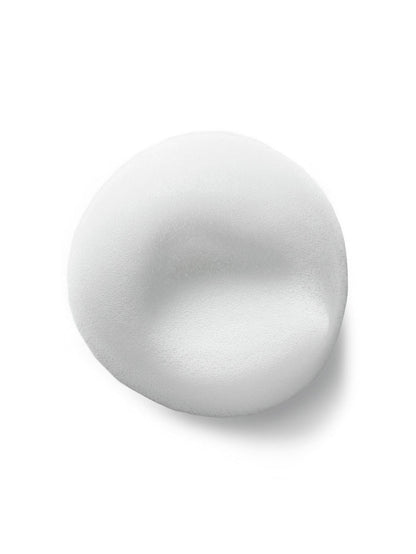 A close-up of fluffy white foaming cleanser texture.
