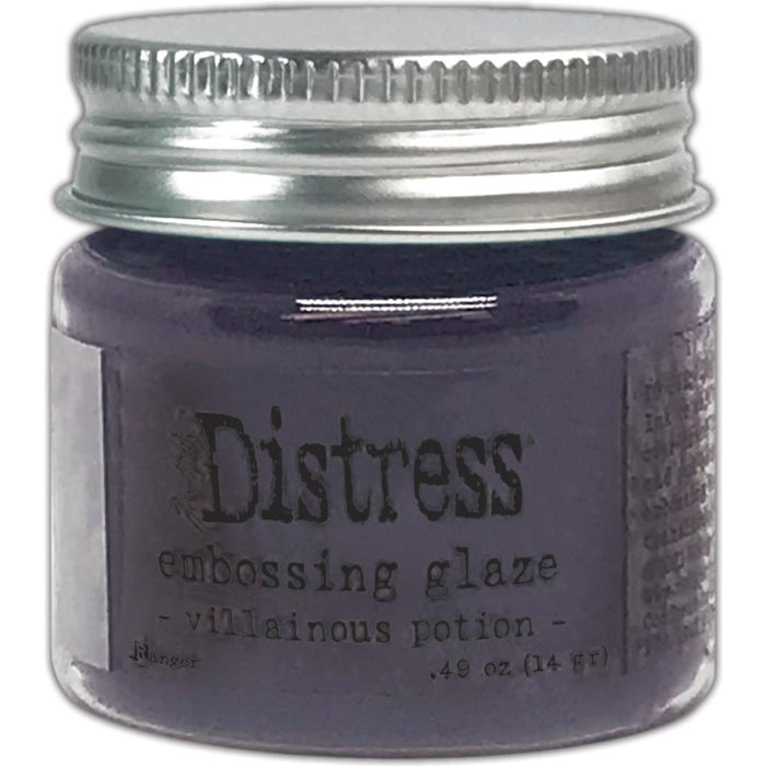 Tim Holtz - Distress Embossing Glaze - Villainous Potion. Add dimension to your projects with new embossing glaze! These translucent embossing powders are ideal for layering on surfaces. This package contains .49oz of embossing glaze. Conforms to ASTM D 4236. Comes in a variety of colors. Each sold separately. Made in USA. Available at Embellish Away located in Bowmanville Ontario Canada.