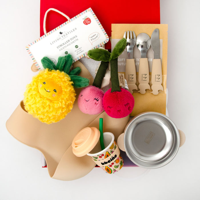 Collection of children's items including a plush toy, cutlery set, bowl, bib and cup in a red gift box. $135.00