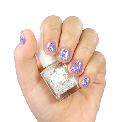Twinkle Twinkle glitter nail polish layered over lavender, hand holding the bottle