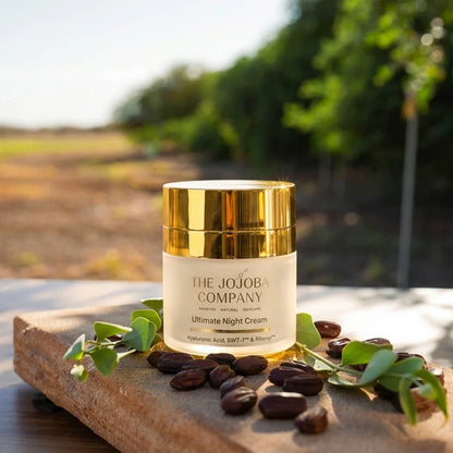 Jojoba oil container with jojoba seeds on a stone surface with a natural background