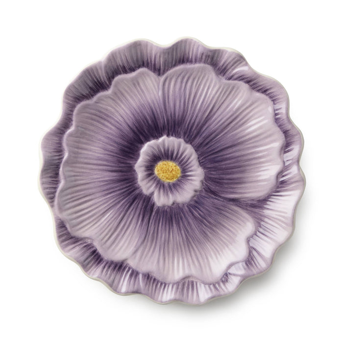 Decorative purple flower plate on a white background