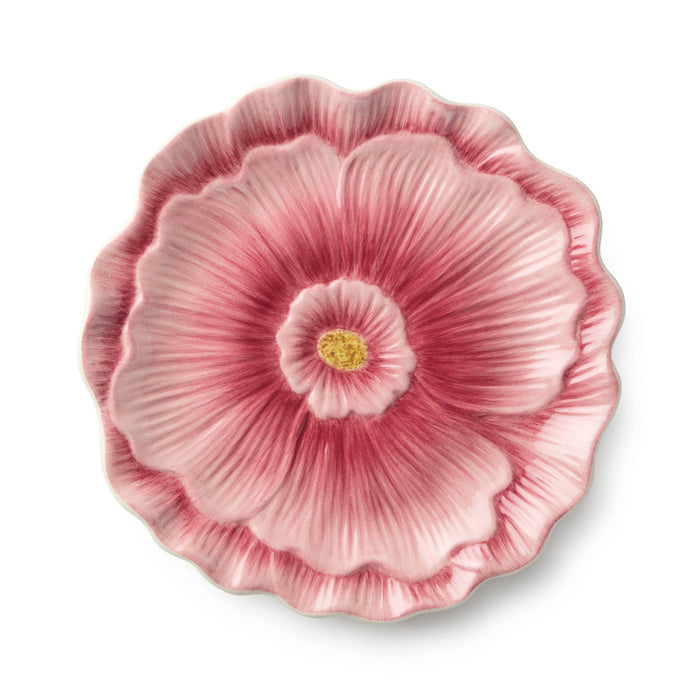 Pink floral-patterned plate on a white background