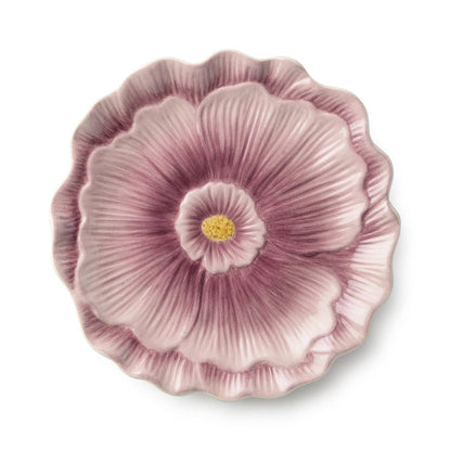 Decorative wall plate with a pink floral design on a white background