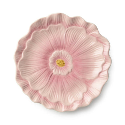 Pink floral ceramic plate on a white background